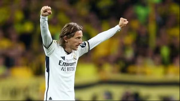 Modric comemora na final da Liga dos Campeões.(Imagem:Hannah McKay / Reuters)