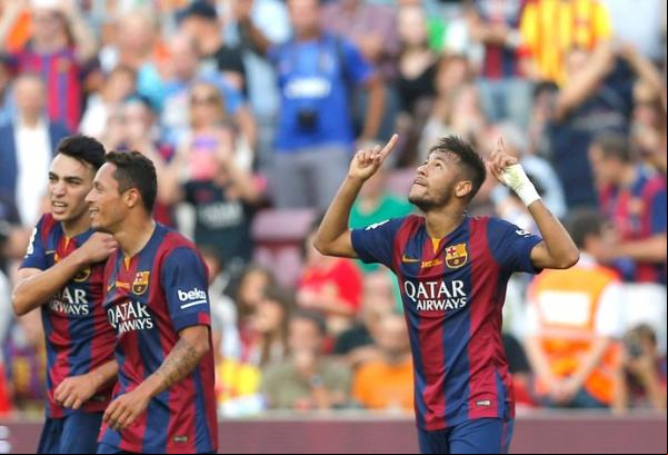 Neymar comemora um de seus gols na surra sobre o Granada.(Imagem:(AP))